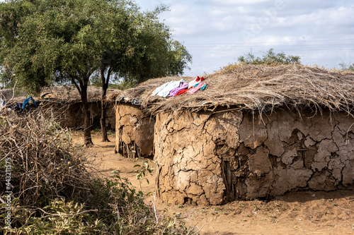 houses of a Maasai village made of wicker branches and clay with protection from thorns from wild animals 