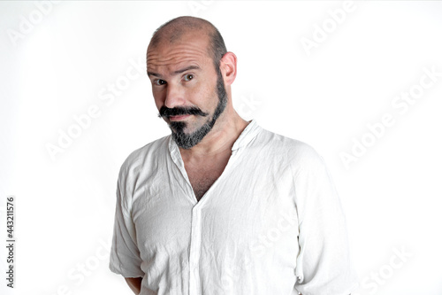 portrait of caucasian person on white background with mustache and beard looking at camera with doubtful expression. © Valoa Studio