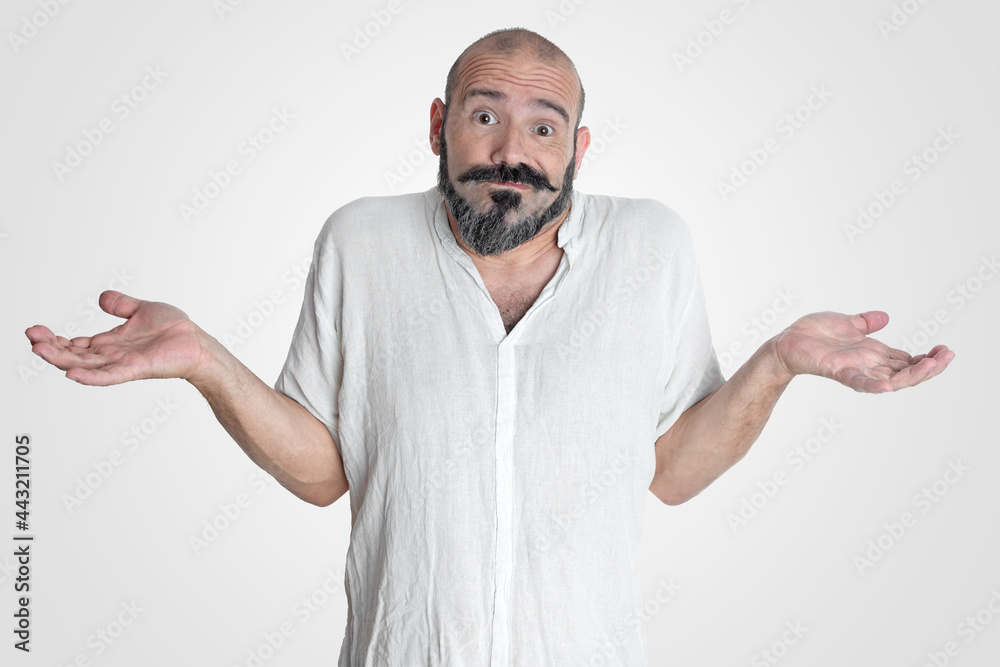 Caucasian man with mustache and beard making an expression of I don't know, dressed in white on white background