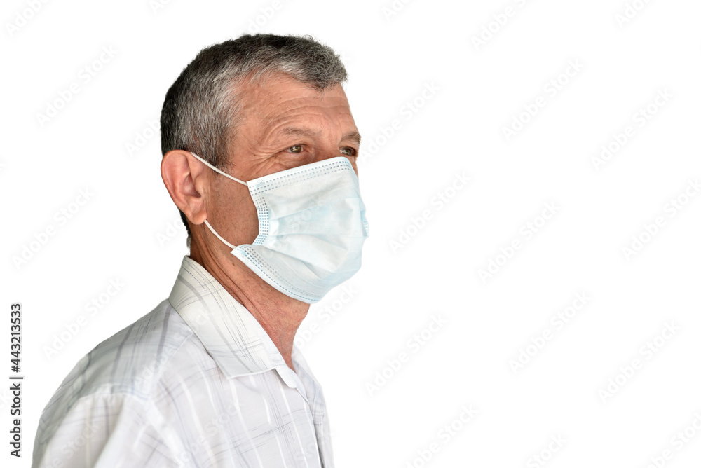 An elderly man in a medical mask on a white background An elderly man in a medical mask on a white background