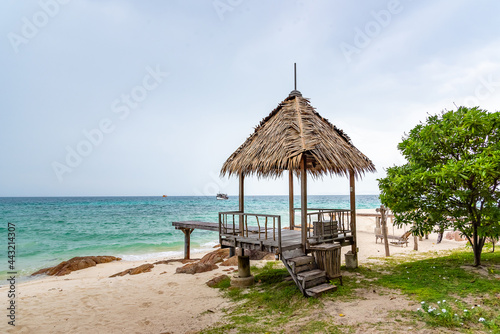 Nature in twilight period which including of sunrise over the sea and the nice beach. Summer beach with blue water and purple sky at the sunset. 