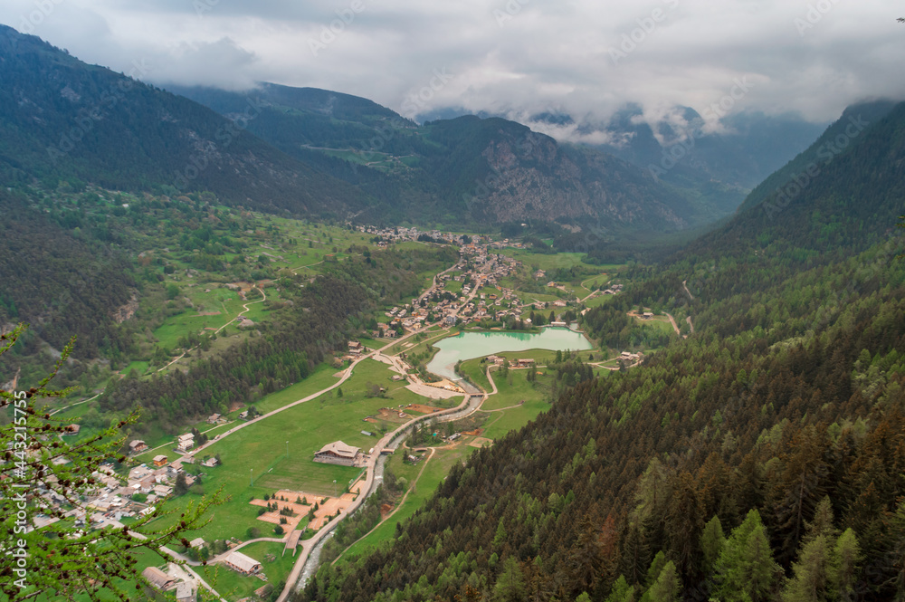 Aerial view of the little mountain town of Brusson with its nice lake in Ayas valley in Val D'Aosta, Italy