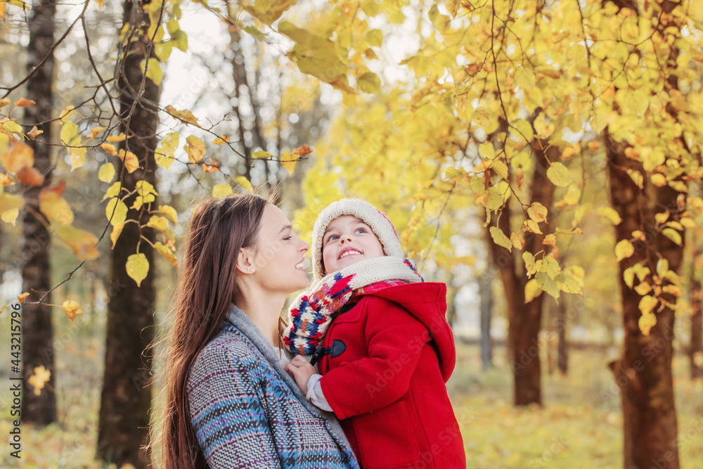 happy mother and daughter in autumn park happy mother and daughter in autumn park