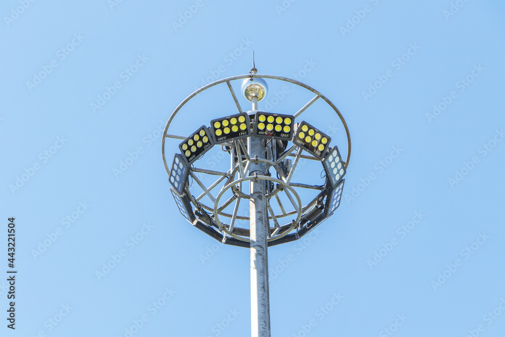 close-up photo big Spotlight pole in the sky background. Beautifully shaped set in a park to illuminate the night. technology that gives light close-up photo big Spotlight pole in the sky background. Beautifully shaped set in a park to illuminate the night. technology that gives light