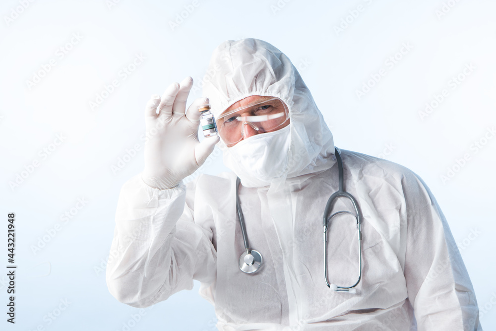 NO LOGOS OR TRADEMARKS!  SELF MADE LABELS! Close up view of doctor with an ampule of covid vaccine on blue back