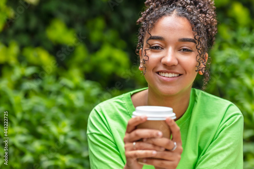 Φωτογραφία Mixed Race African American Teenager Woman Drinking Coffee