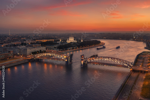 Aerial view of the Peter the Great Bridge ( Bolsheokhtinsky bridge ) and Smolny Cathedral at summer white night time, Saint Petersburg, Russia. photo