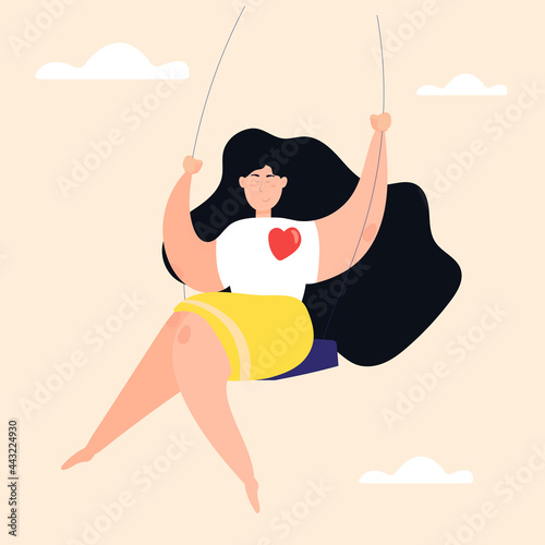 Self-love and healthy lifestyle concept. The girl is swinging and enjoying life. In harmony with yourself.