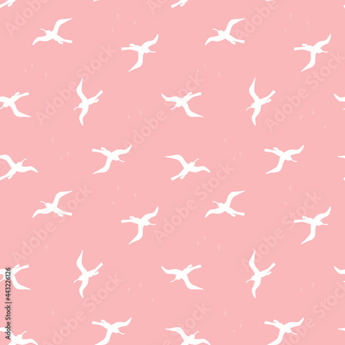 Seamless pattern with white birds on pink background. Silhouettes of seagulls flying in the sky. Vector colored endless texture for your designs packing, cards, wrapping paper, textile, towels