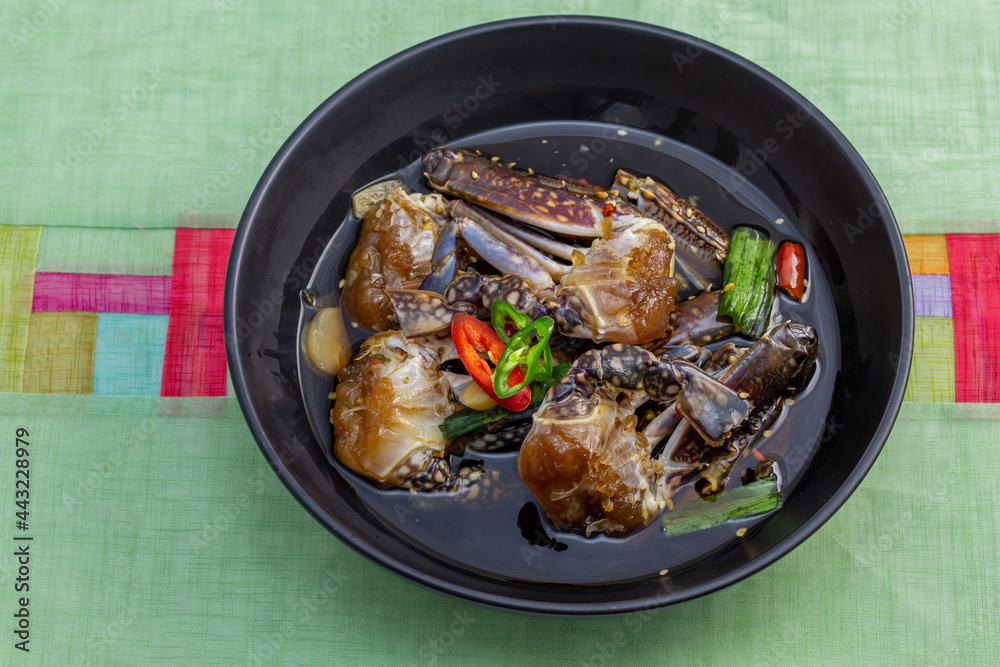 Korean food Raw crabs marinated in soy sauce which is called Ganjang-gejang Korean food Raw crabs marinated in soy sauce which is called Ganjang-gejang