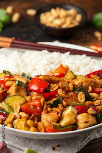 Kung Pao Chicken with Peppers, zucchini and rice. Asian take away food