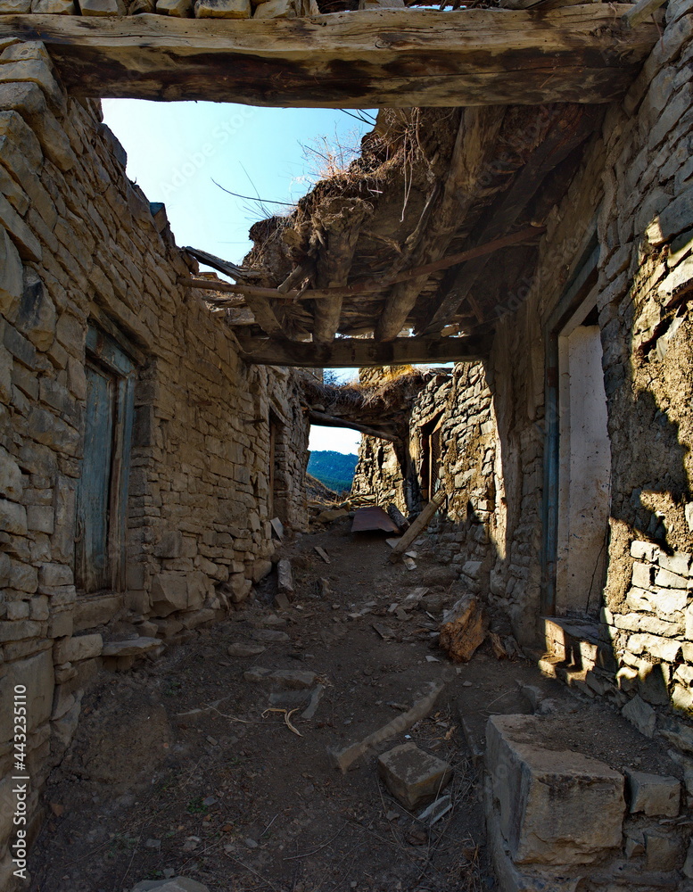 Russia. North-Eastern Caucasus, Dagestan. The stone houses of the abandoned part of the mountain village of Khushtada destroyed by time. Traditionally, all houses and fences are made of rock. Russia. North-Eastern Caucasus, Dagestan. The stone houses of the abandoned part of the mountain village of Khushtada destroyed by time. Traditionally, all houses and fences are made of rock.