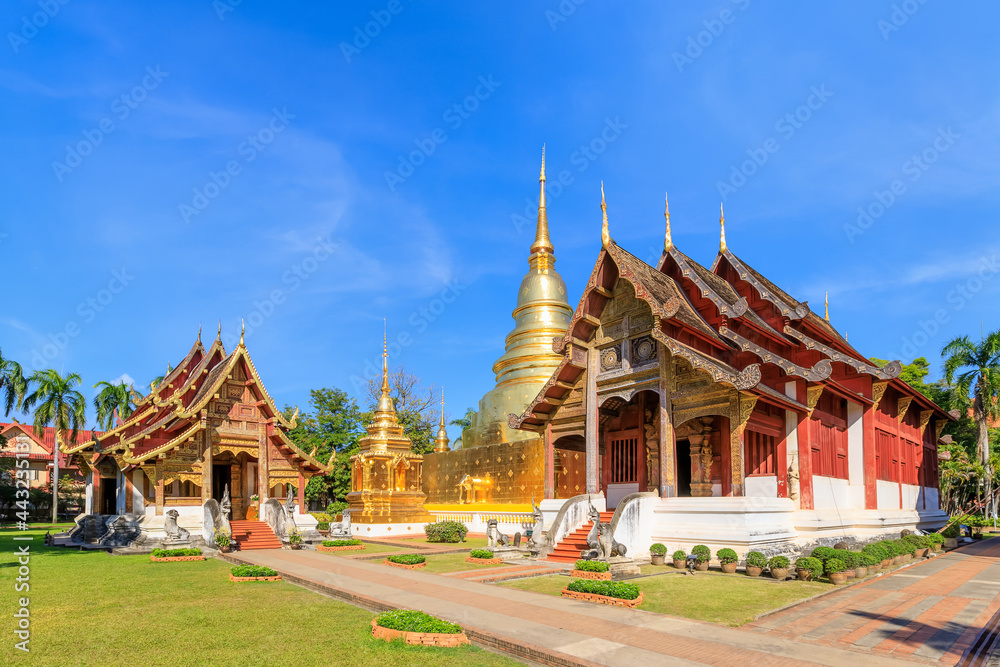 Chapel and golden pagoda at Wat Phra Singh Woramahawihan, famous travel destination in Chiang Mai, Thailand Chapel and golden pagoda at Wat Phra Singh Woramahawihan, famous travel destination in Chiang Mai, Thailand