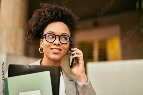 Young african american businesswoman smiling happy talking on the smartphone at the city.