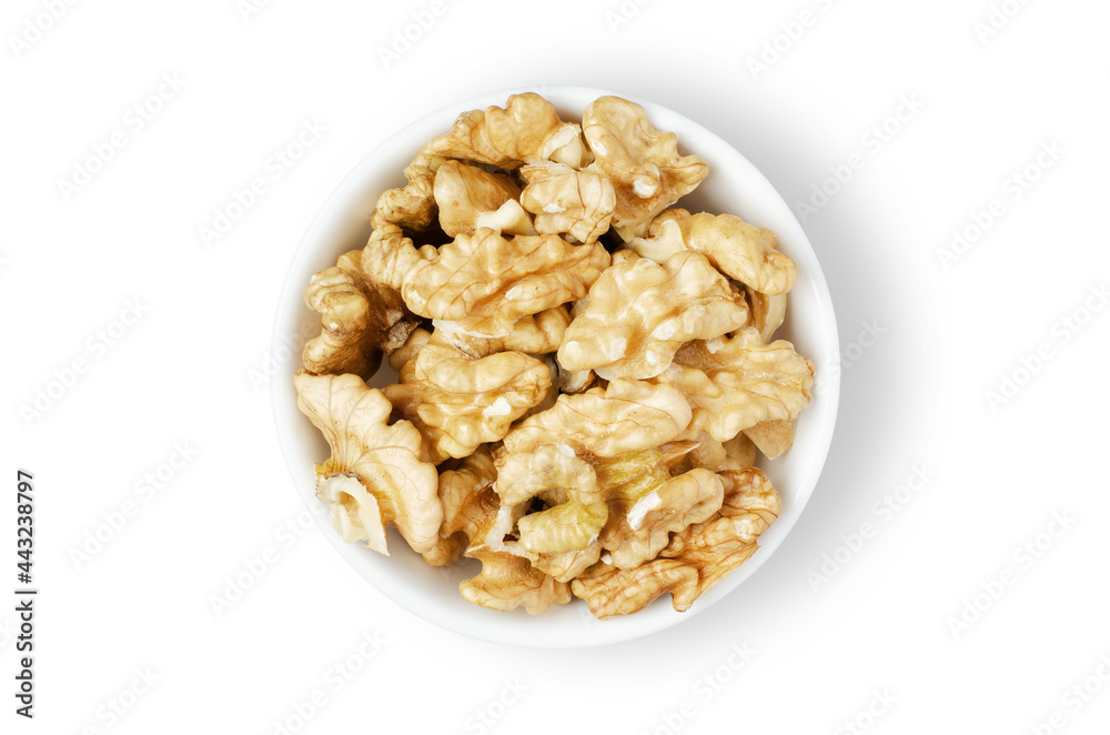 Peeled walnut kernels in a bowl. Isolated on a white background. Nuts contain vegetable protein and vitamins. For a healthy and vegetarian diet Peeled walnut kernels in a bowl. Isolated on a white background. Nuts contain vegetable protein and vitamins. For a healthy and vegetarian diet