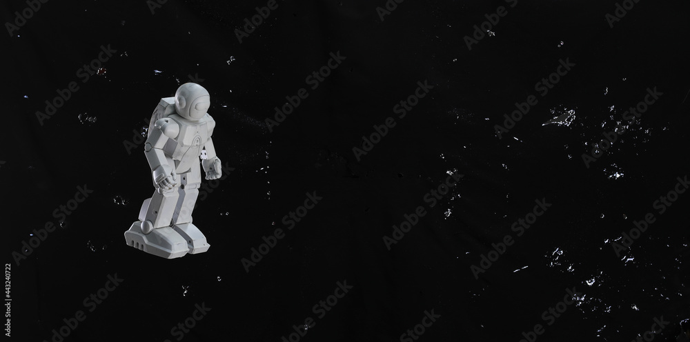 toy astronaut on a black sky toy astronaut on a black sky
