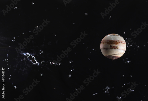 Planet Jupiter on a starry black sky photo