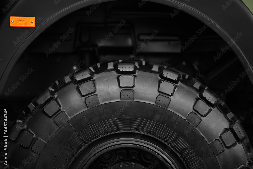 wheel of military off-road truck in closeup