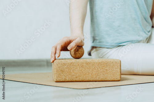Картината върху платно Side view of person doing palmar fascia release with a small cork ball on a cork