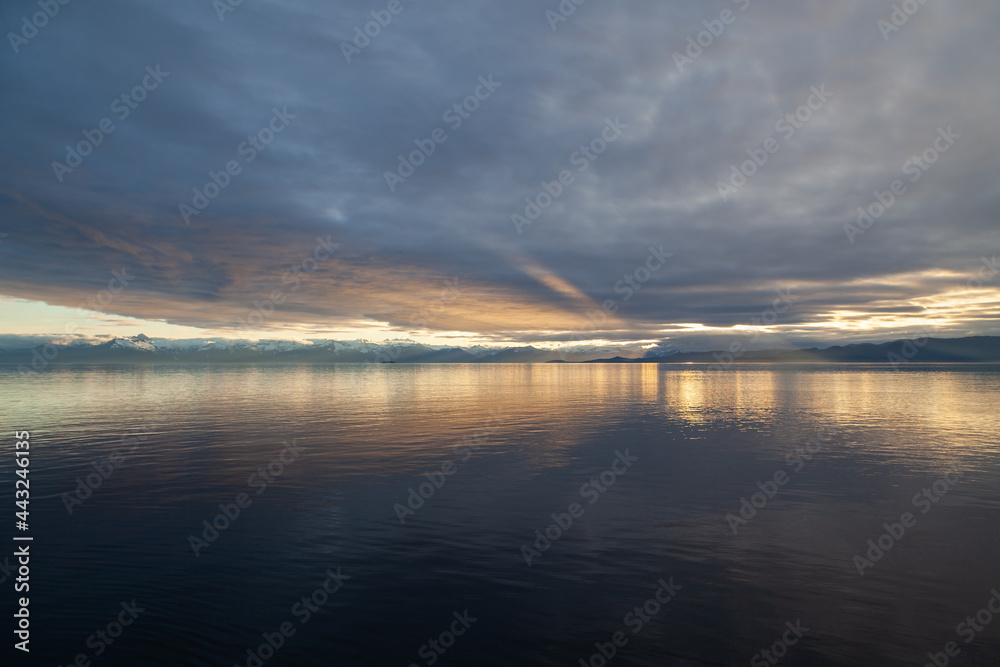 Fototapeta premium Sunset on mountains and sea in South East Alaska