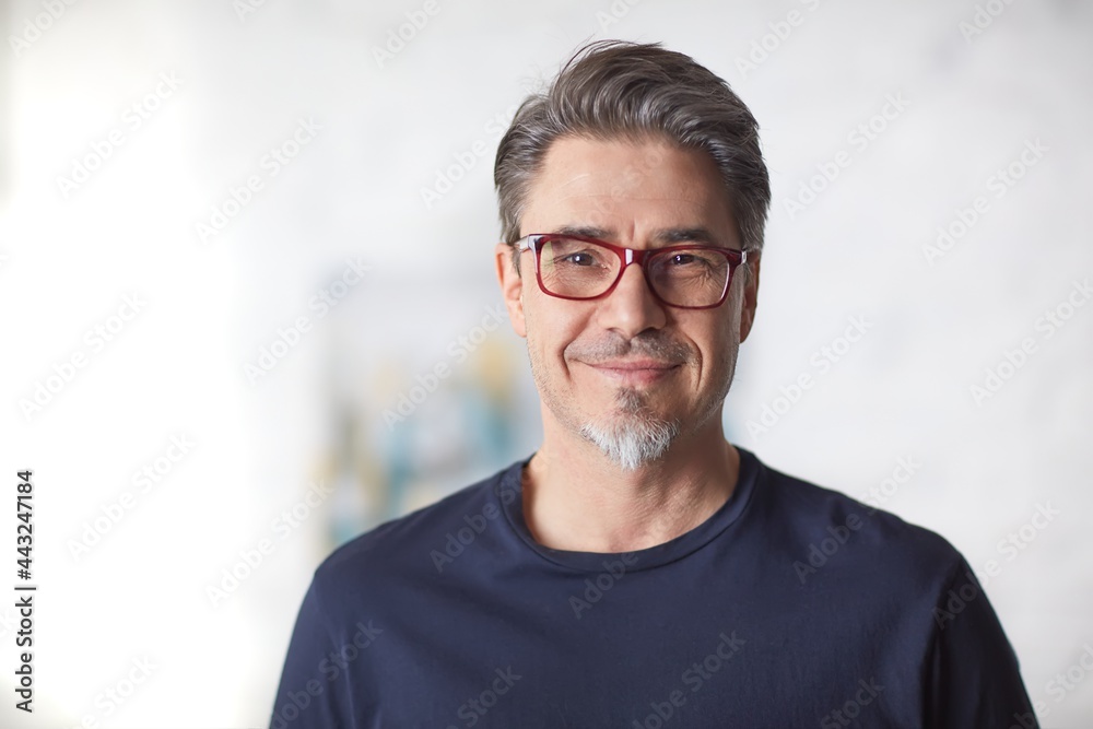 Indoor portrait of white older man with gray hair, wearing eyewear. Indoor portrait of white older man with gray hair, wearing eyewear.