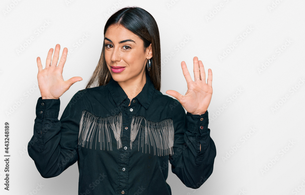 Young hispanic woman wearing casual clothes showing and pointing up with fingers number six while smiling confident and happy. Young hispanic woman wearing casual clothes showing and pointing up with fingers number six while smiling confident and happy.