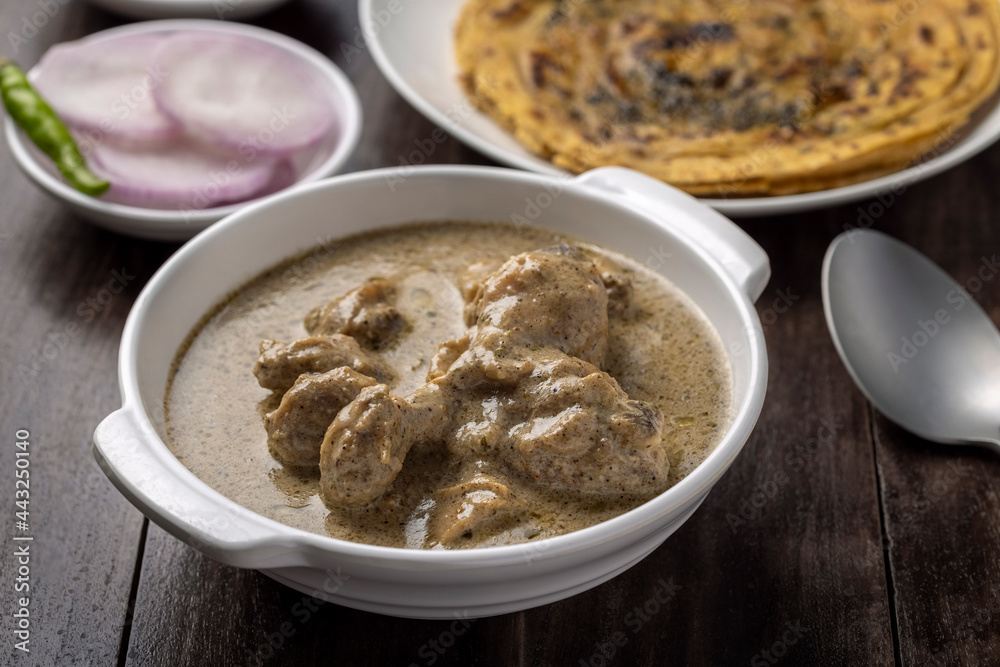 cream chicken curry with flatbread chapati or parantha cream chicken curry with flatbread chapati or parantha