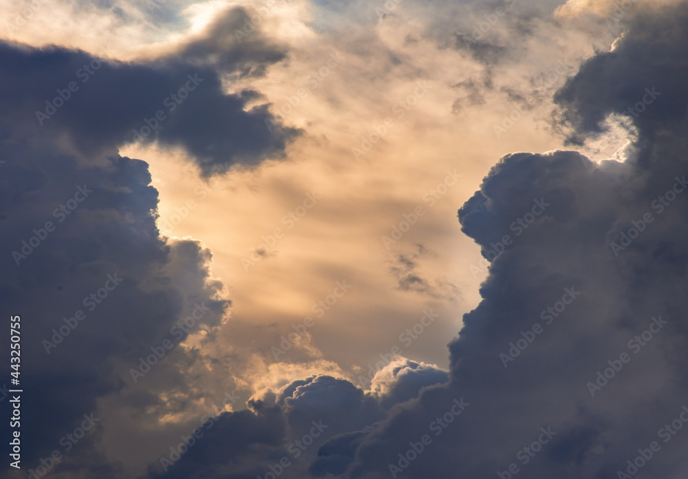 The sun shines through the clouds in the sky. The shape of the clouds evokes imagination and creativity. They can be used as wallpapers that look amazing. Copy space, No focus, specifically. The sun shines through the clouds in the sky. The shape of the clouds evokes imagination and creativity. They can be used as wallpapers that look amazing. Copy space, No focus, specifically.