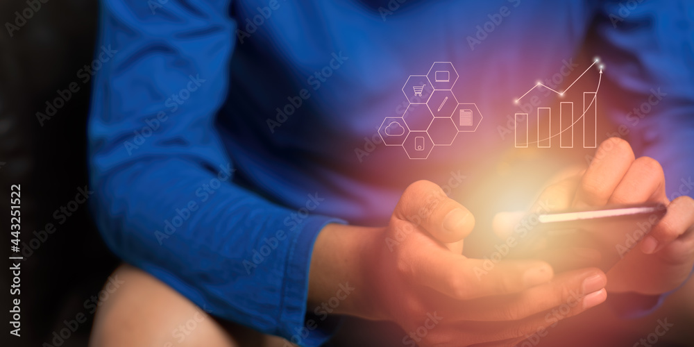 Man in a blue shirt is sitting at home trading stocks during the Covid-19 situation, focusing on computer-altered fingers. Man in a blue shirt is sitting at home trading stocks during the Covid-19 situation, focusing on computer-altered fingers.