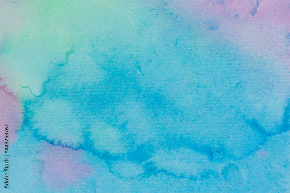 abstract watercolor background in blue, green and pink