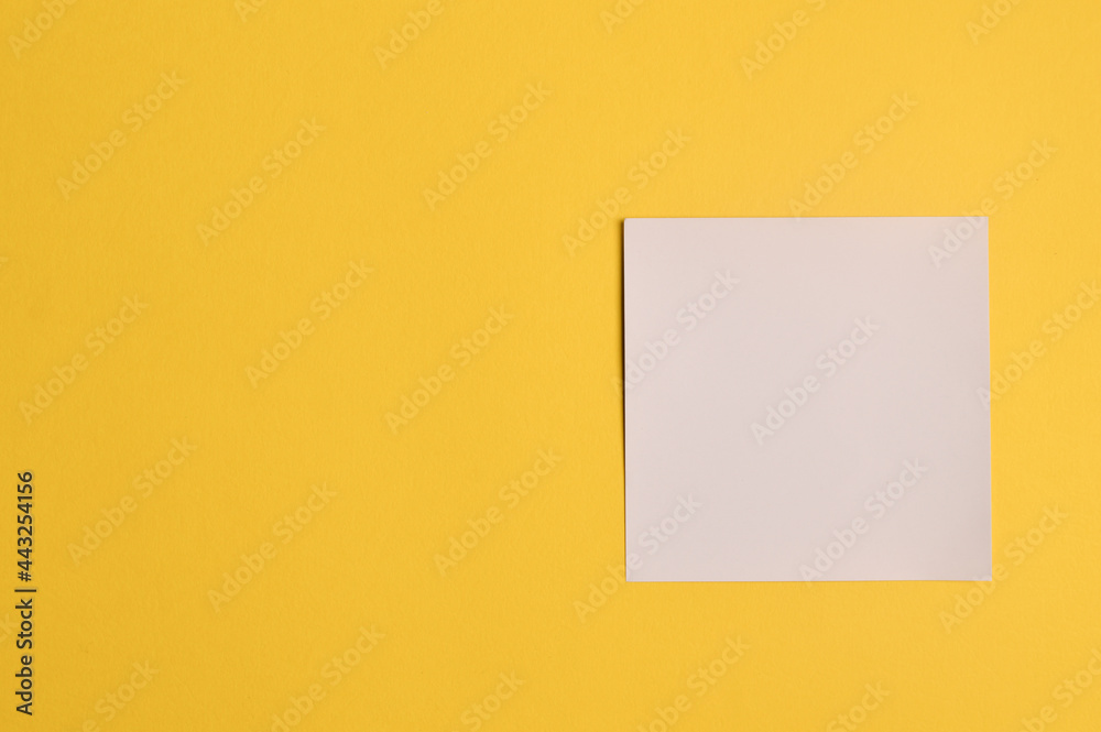 Memo note isolated on yellow background. Copy space for the text. Memo note isolated on yellow background. Copy space for the text.