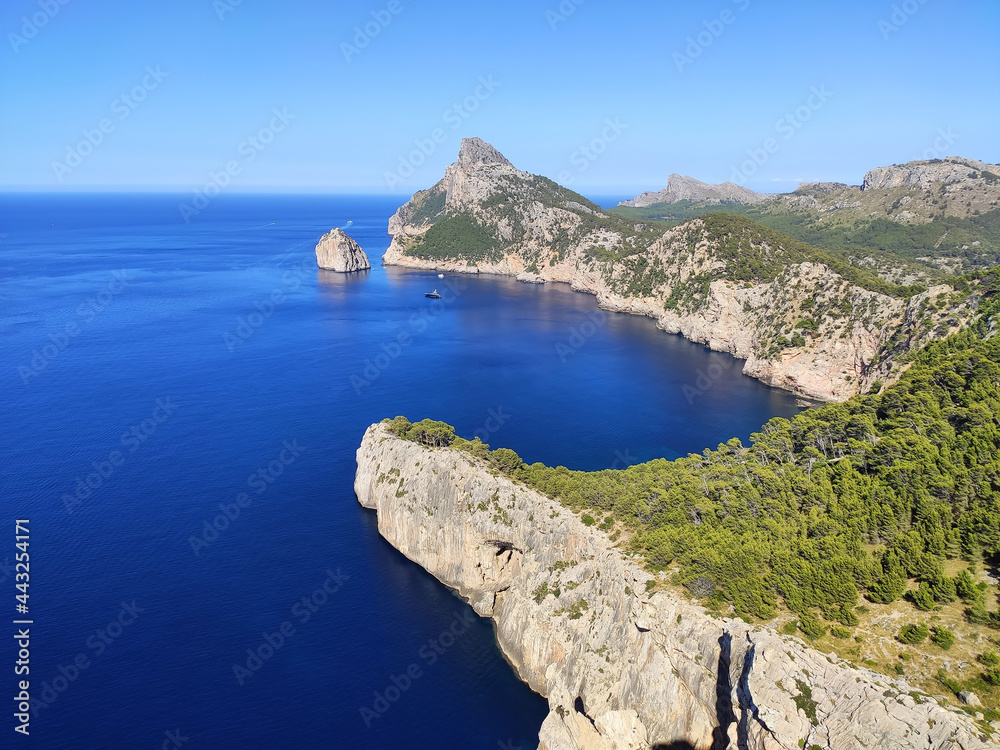 Scenic view from Es Colomer Viewpoint Mirador on Formentor Peninsula with famous Formentor Lighthouse and magnificent rocky cliffs near Port de Pollenca on Mallorca, Balearic Islands, Spain