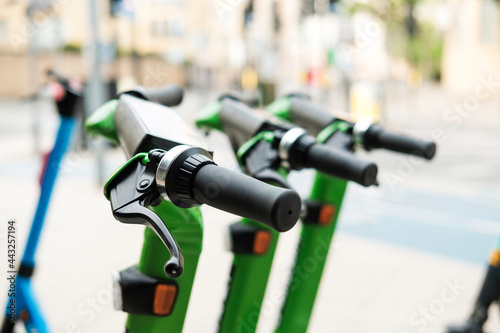 Group of E-scooters parked in the street in London.