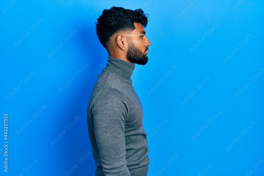 A man with a goatee and a turtle neck sweater photo – Man face