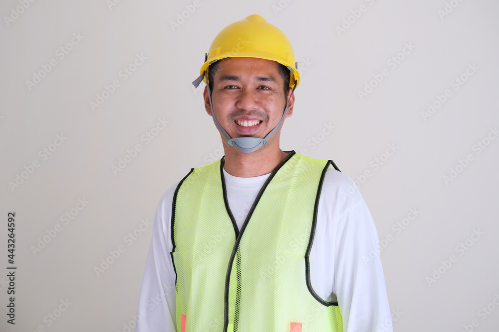 Asian construction worker smiling confident Asian construction worker smiling confident