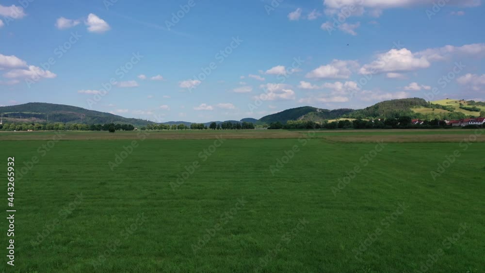 The landscape of the Werra Valley with the Werra River and agriculture fields at Herleshausen in Hesse and Thuringia The landscape of the Werra Valley with the Werra River and agriculture fields at Herleshausen in Hesse and Thuringia