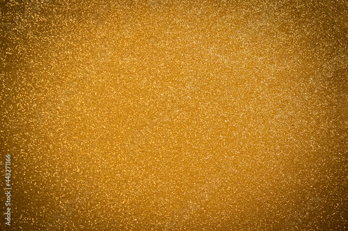 Abstract twinkled bright background with bokeh defocused golden lights
