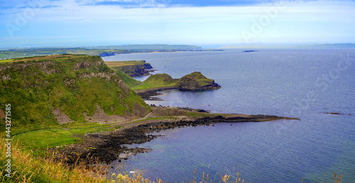 Panorama of Atlantic coastline in Northern Ireland with Giant’s Causeway, unique natural geological formations of volcanic basalt rocks, resembling cobblestones, gulf, bays, peninsulas and cliffs