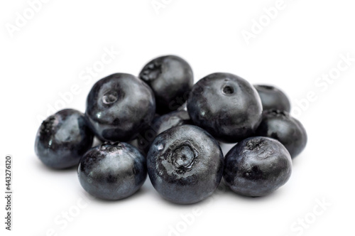Heap of blueberries isolated on white background. Close up.