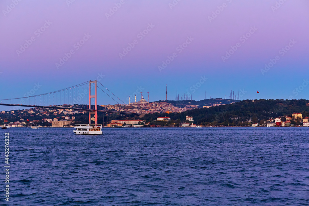 Evening boat trip on the Bosphorus in Istanbul. Bosphorus Bridge, in the night lights