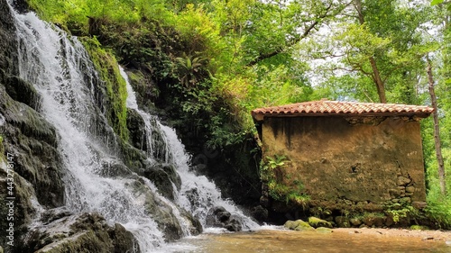 Water mill in PR AS 137 trail between Valbucar and BUsllaz villages, also known as 'Molinos del profundu', Villaviciosa, Asturias, Spain photo