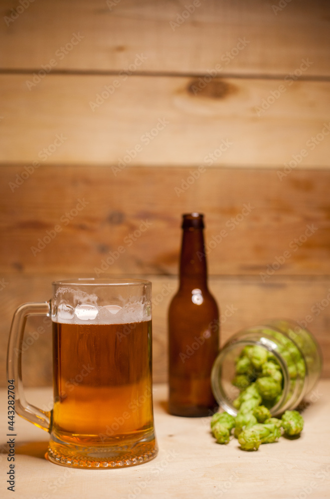 Glass of light beer with hops
