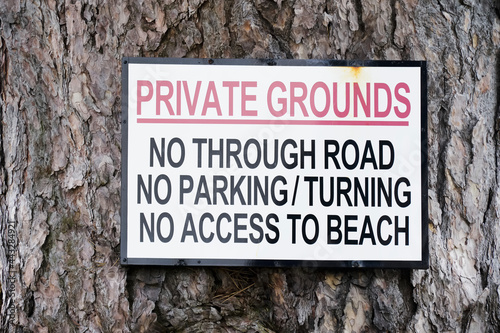 No parking private grounds sign outside house