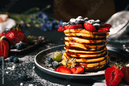Pancake. Tasty pancakes with fruits, strawberries, berries, sugar. Pancakes with chocolate. Dessert. Breakfast pancakes. 