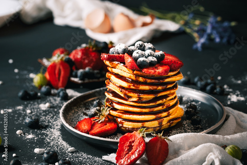 Pancake. Tasty pancakes with fruits, strawberries, berries, sugar. Pancakes with chocolate. Dessert. Breakfast pancakes. 