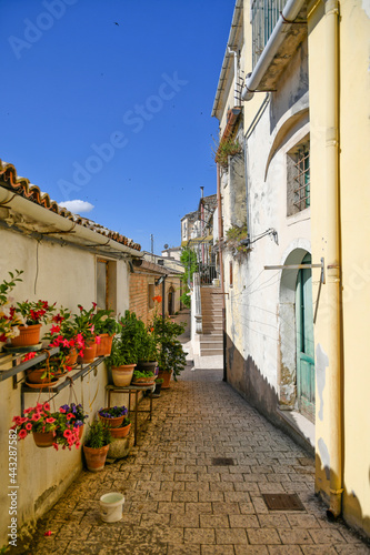 A narrow street between the old houses of Sant'Agata di Puglia, a medieval village in southern Italy.