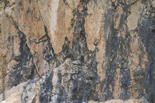 Marble stone background. Natural stone texture. Marble pattern with curly grey and orange veins. Abstract texture and background.