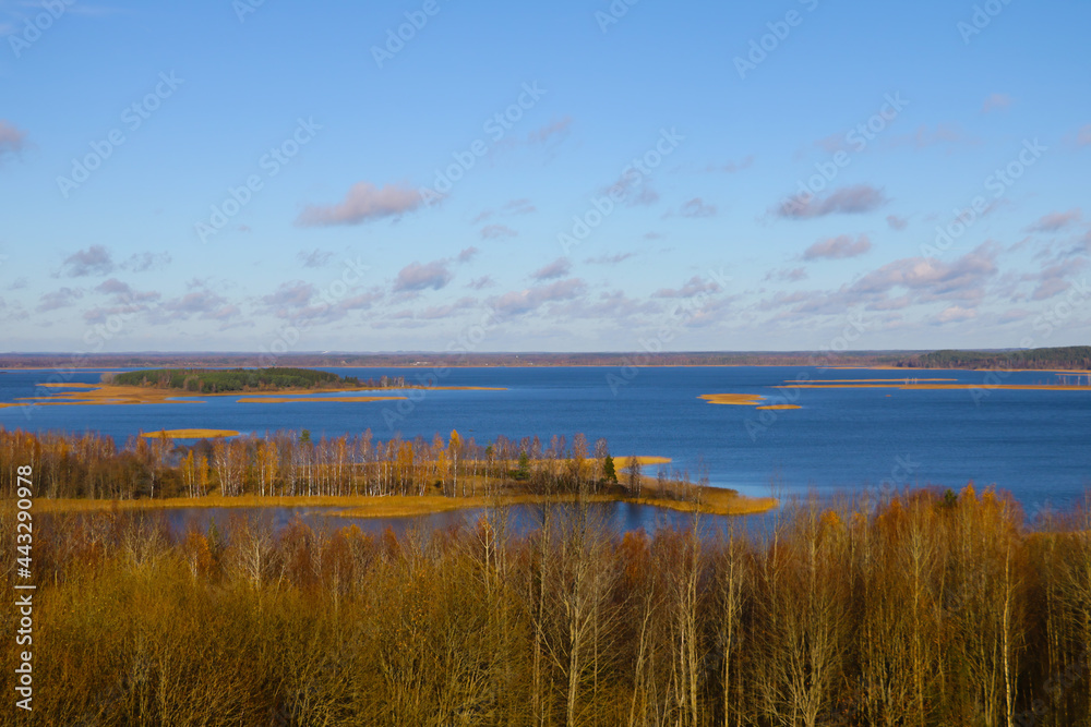 View from the top to a beautiful lake in autumn. View from the top to a beautiful lake in autumn.