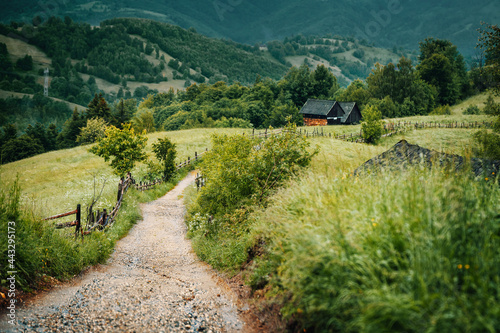 road in the mountains against barns