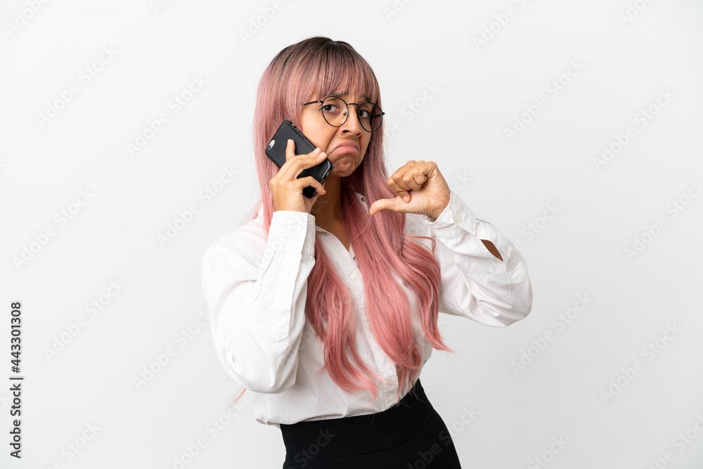 Young business mixed race woman with pink hair holding a mobile isolated on pink background proud and self-satisfied Young business mixed race woman with pink hair holding a mobile isolated on pink background proud and self-satisfied